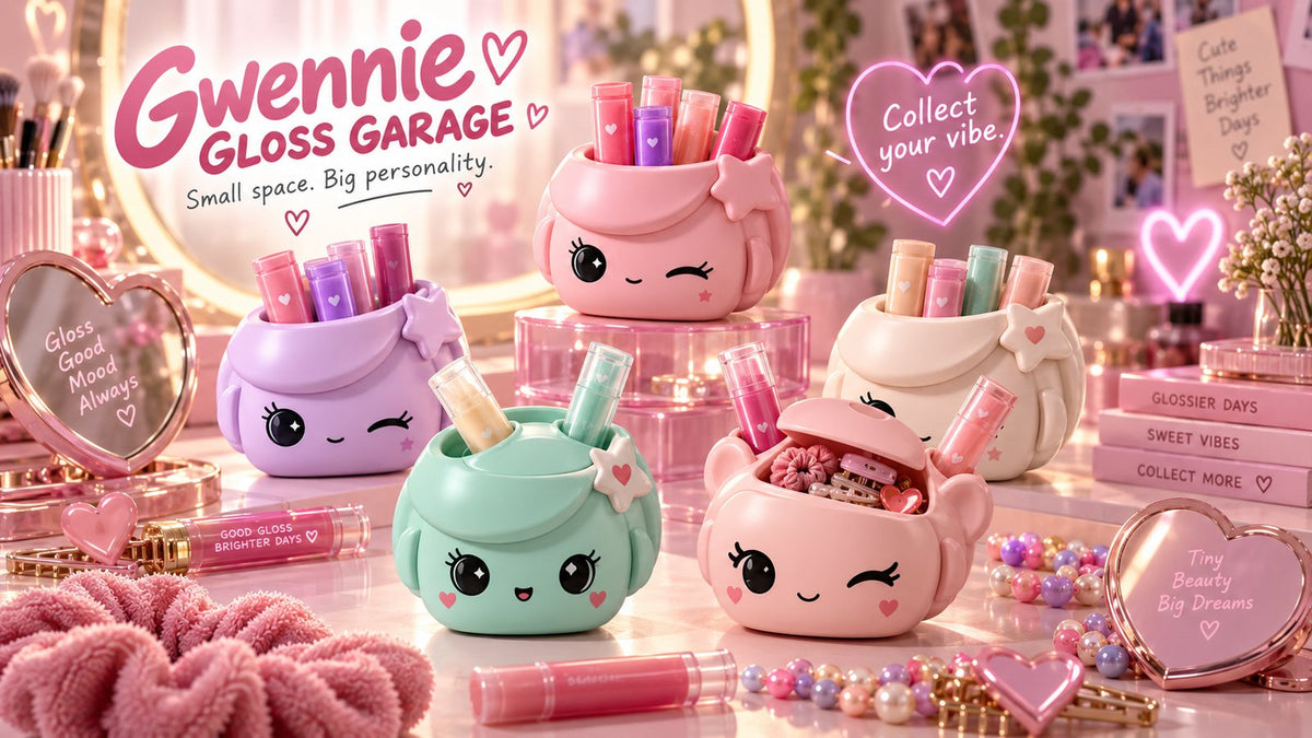 Five Gwennies on a vanity with glosses, clips, and a heart mirror